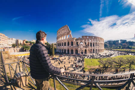 Male tourist enjyoing the view at the Colosseum in Rome, Italyのeditorial素材