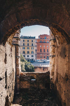 Archway in Colosseum with Rome city streets visibleの写真素材