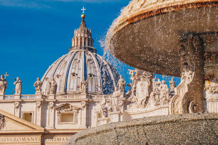 Saint Peter's Basilica  dome and the fountain in front in Vatican City, Rome, Italy. Focus on the dome.のeditorial素材