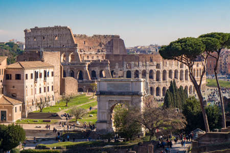 Titus Arch and the Roman Colosseum in Rome, Italy as seen from the Palatine Hillのeditorial素材