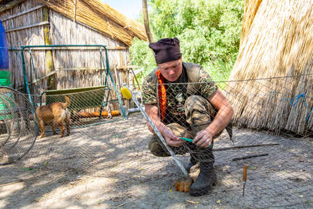 Danube Delta, Romania, May 2018: Traditional fisherman in Danube Delta working on his fishing netのeditorial素材