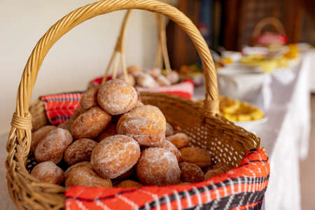 Homemade romanian doughnuts in a basketの写真素材