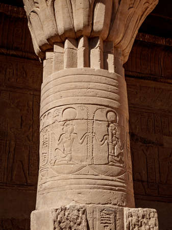 Column decorated with ancient hieroglyphs at Philae Temple in Aswan Egypt