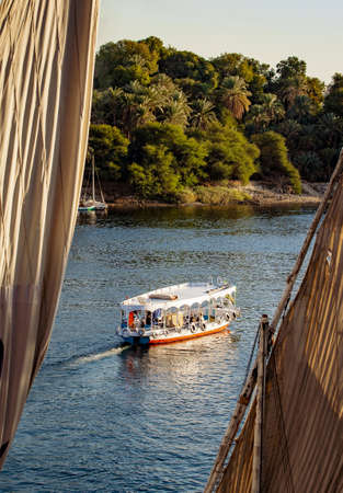 Nile river tourist boat at sunset in Luxor Egypt