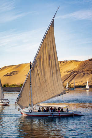 Tourists in a Felucca boat on the Nile River in Luxor Thebesの写真素材