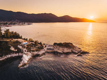 Thasos Beach Karnagio at sunset and Limenas town visible to the left