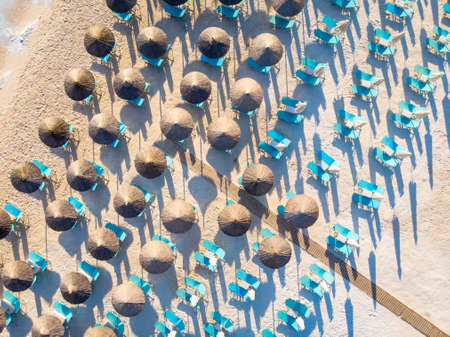Aerial view of sunchairs and umbrellas at Porto Vathy Beach, Thasosの写真素材