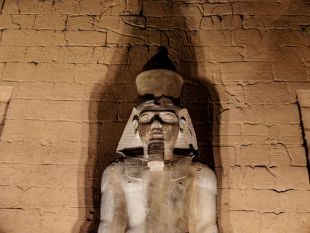 Granite statue of Ramses II at Luxor Temple illuminated at nightのeditorial素材