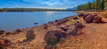 A boulder strewn shoreline on the north side of Dogtown Lake near Williams Arizona.の写真素材