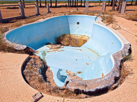An abandoned swimming pool I found while exploring the Arizona desert near the Eagle Tail Mountains in Harquahala Valley. The home this pool belonged burned down years ago.の写真素材