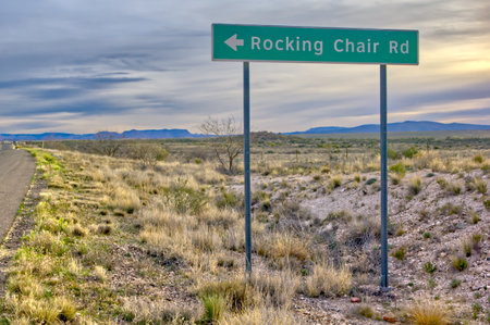 Sign marking Rocking Chair Road on the north side of Cottonwood Arizona. This road branches off of Historic 89A and leads to a subdivision for retired people.の写真素材