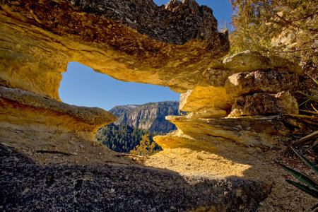 A rock arch along the Telephone Trail north of Sedona AZ. It is among a group of arches called the...