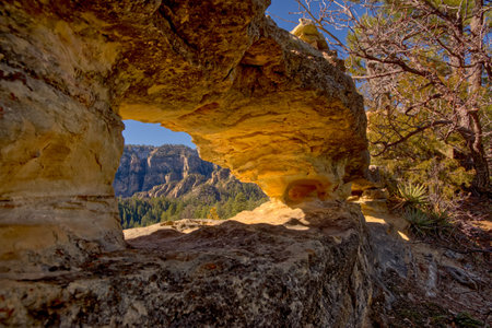 A rock arch along the Telephone Trail north of Sedona AZ. It is among a group of arches called the Peep Holes.の写真素材