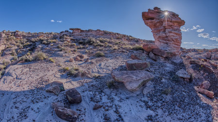 A hoodoo tower along the Billings Gap Trail in Petrified Forest National Park Arizona with a hole in it that resembles an Eagle Eye.の写真素材