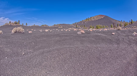 Volcanic cinder hills in Coconino National Forest near Sunset Crater National Monument of Arizona.の写真素材