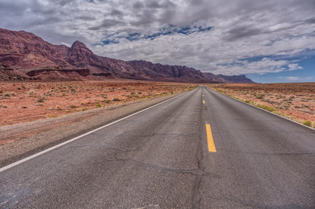 View of Echo Cliffs near Marble Canyon Arizona from US89A on a mostly cloudy day. This section of the cliffs is near the little town of Bitter Springs on the Navajo Reservation adjacent to the Vermilion Cliffs National Monument.の写真素材