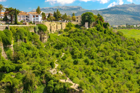 Viewpoint, scenic overlook from the new bridge in Ronsa, Andalusia, Spain. Long staircase in the middle of green bushes with the viewpoint / belvedere facing the famous bridge.のeditorial素材