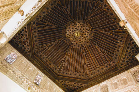 Ceiling with intricate sculpted details of moorish arabian origin / influence, astonishing level of patterns.Ancient beautiful moorish stucco work of Alhambra, Granadaのeditorial素材