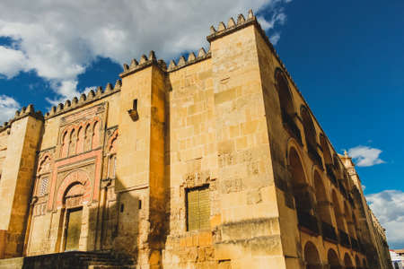 Cordoba, Spain - 5/3/18: View of the Mosque? Cathedral of Cordoba (Mezquita-Catedral of Cordoba) from behind the Gate of the Bridge (Puerta del Puente)のeditorial素材