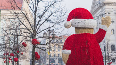 View from the back of giant Santa statue in the middle of Baixa Chiado, Lisbon, Portugal. Red balls...