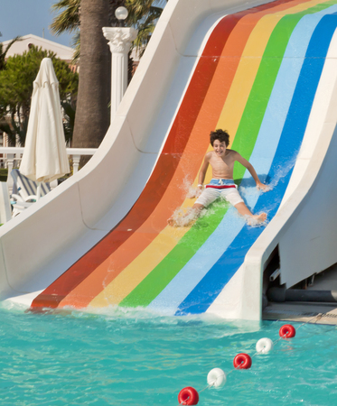 The boy is have fun in the waterparkのeditorial素材