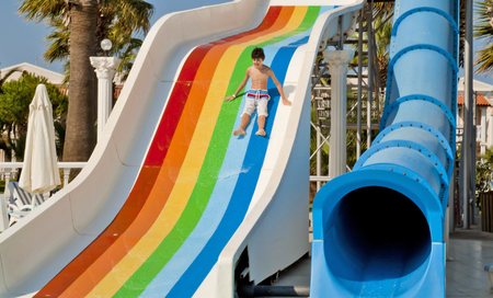 The boy is have fun in the waterparkのeditorial素材