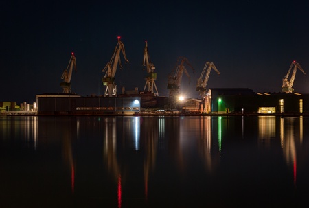 Commercial docks at night with a ship and cranes -Pula,Croatia の写真素材