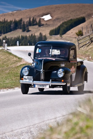 SOMMERALM, AUSTRIA - APRIL 27: Erich Volk in a 1940 Ford USA Pick Up participates in a rally for vintage cars "Suedsteiermark Classic" on April 27, 2012 in Sommeralm, Austria. のeditorial素材