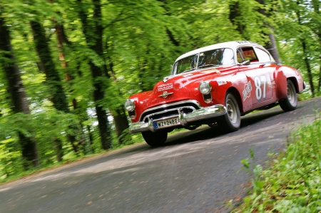 GAMLITZ, AUSTRIA - APRIL 30: An unidentified driver in a 1949 Oldsmobile Rocket 88 participates in a rally for vintage cars "Suedsteiermark Classic" on April 30, 2011 in Gamlitz, Austria.のeditorial素材