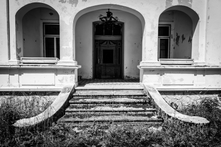 Monochrome photo of entrance to old uninhabited house Austria のeditorial素材
