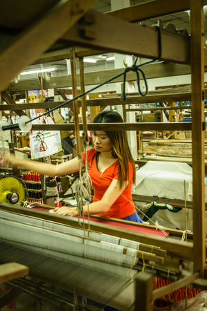 CHIANG MAI, THAILAND - FEB  16  Unidentified woman working at traditional Thai loom, February 16, 2014 in Chiang Mai, Thailand のeditorial素材