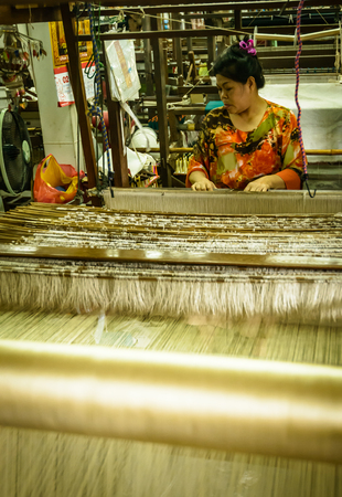 CHIANG MAI, THAILAND - FEB  16  Unidentified woman working at traditional Thai loom, February 16, 2014 in Chiang Mai, Thailand のeditorial素材