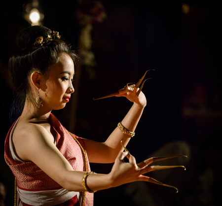 CHIANG MAI, THAILAND - FEBRUARY 16  Unidentified lady performing the finger nail dance traditionally performed to welcome guests  16 February 2014 in Chiang Mai, Thailand のeditorial素材