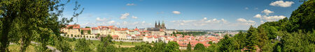 Panorama photo of  Prague- gothic Castle ,the city and trees in foreground  Czech Republic の写真素材