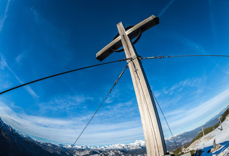 Cross on the mountain peak Orlova Glava,Triglav National Park,Slovenia against a blue sky.の写真素材
