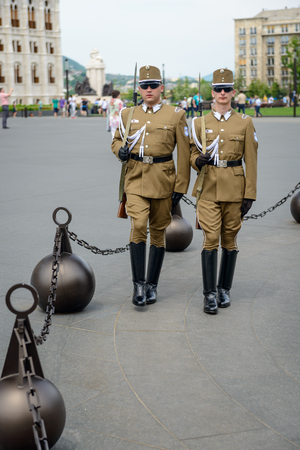 BUDAPEST, HUNGARY - MAY 29, The Hungarian soldier guarding the Hungarian Parliament building on 29 May 2016, Budapest, Hungary.のeditorial素材