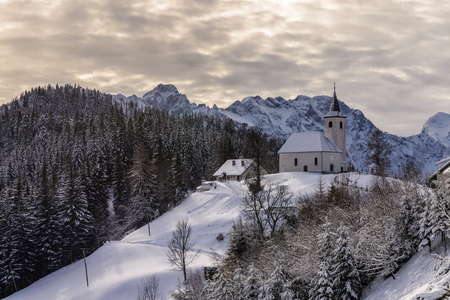 Snowy, winter landscape with Solcava panoramic road, Logarska Dolina,Slovenia.A popular tourist and travel destination.の写真素材