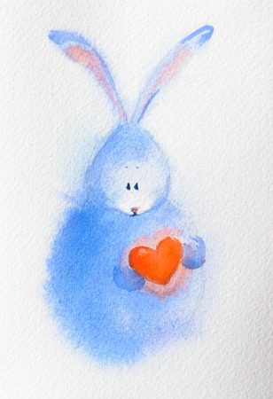 Cute and funny rabbit, bunny holding red heart, cartoon  illustration isolated on white background. Easter, birthday greeting decoration painted with watercolors on paper.の写真素材