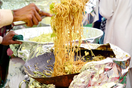 Indian street food making of vegetarian noodlesの写真素材