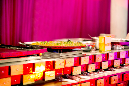 Beautifully decorated catering banquet table with variety of different food snacks and appetizers on party event or wedding celebrationの写真素材