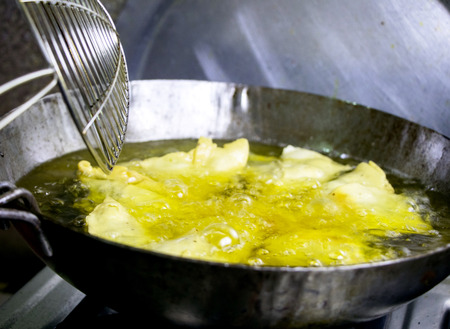 Deep fried golden brown and crispy indian samosas.の写真素材