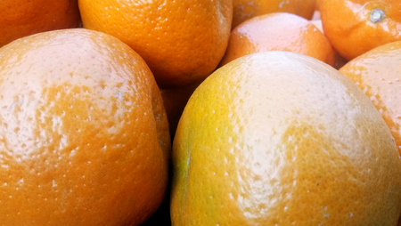 Fresh oranges texture. Bunch of fresh oranges on market, Stack of oranges. Pile of a Fresh Oranges for Background. Orange fruit backgroundの写真素材