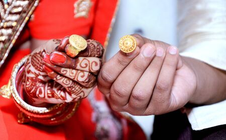 An Indian bride and groom their Shows Engagement Rings during a Hindu wedding ritual