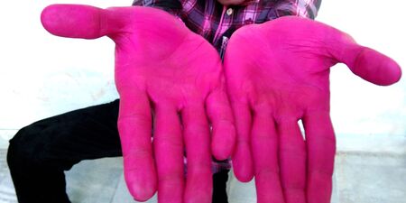 Young boy painted hands to the color powder in festival oh holiの写真素材