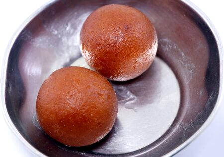 Sweet Gulab Jamun -popular Indian dessert or Doughnuts for festivals and weddingsの写真素材