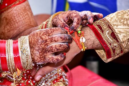 Indian couple playing Ring Fishing game in wedding ceremony of India