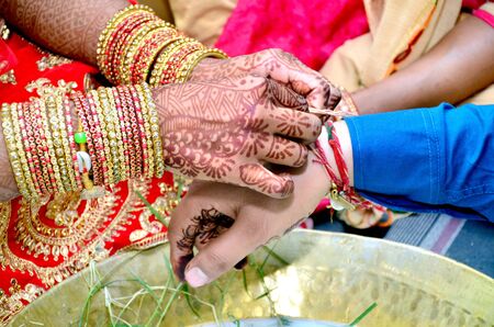 Indian couple playing Ring Fishing game in wedding ceremony of Indiaの写真素材