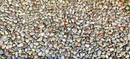 Small pebble stones on the shore of the seaの写真素材