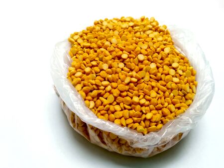 Split Chickpea Also Know as Chana Dal, Yellow Chana Split Peas, Dried Chickpea Lentils or Toor Dal isolated on white Backgroundの写真素材