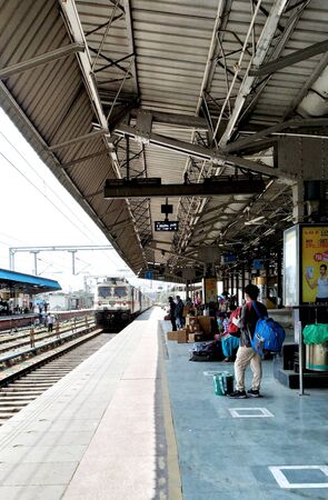 Ludhiana, punjab, india, 14th june 2020 : the train arriving at the platform unidentified peoples are waiting the train at ludhiana railway stationの写真素材
